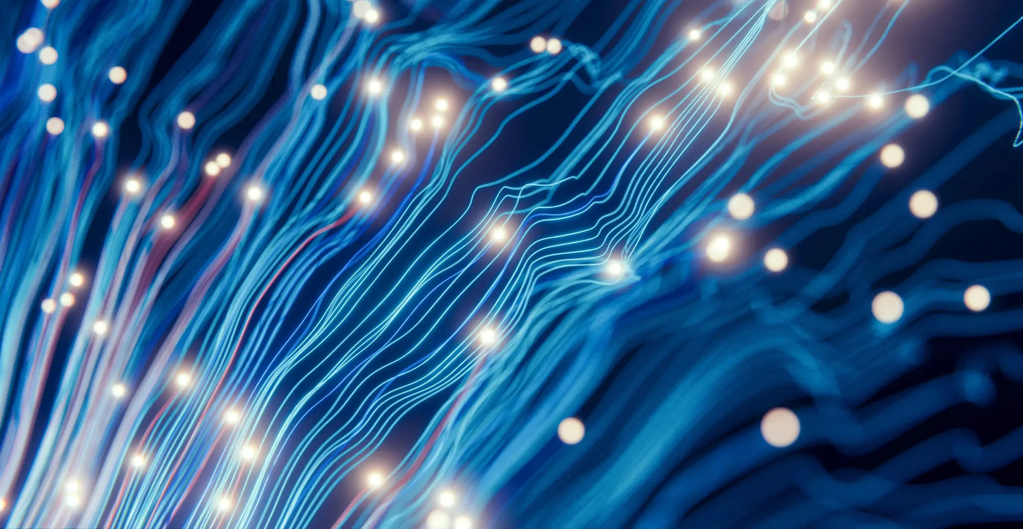 Glowing strands of fiber-optic data light on a dark blue background