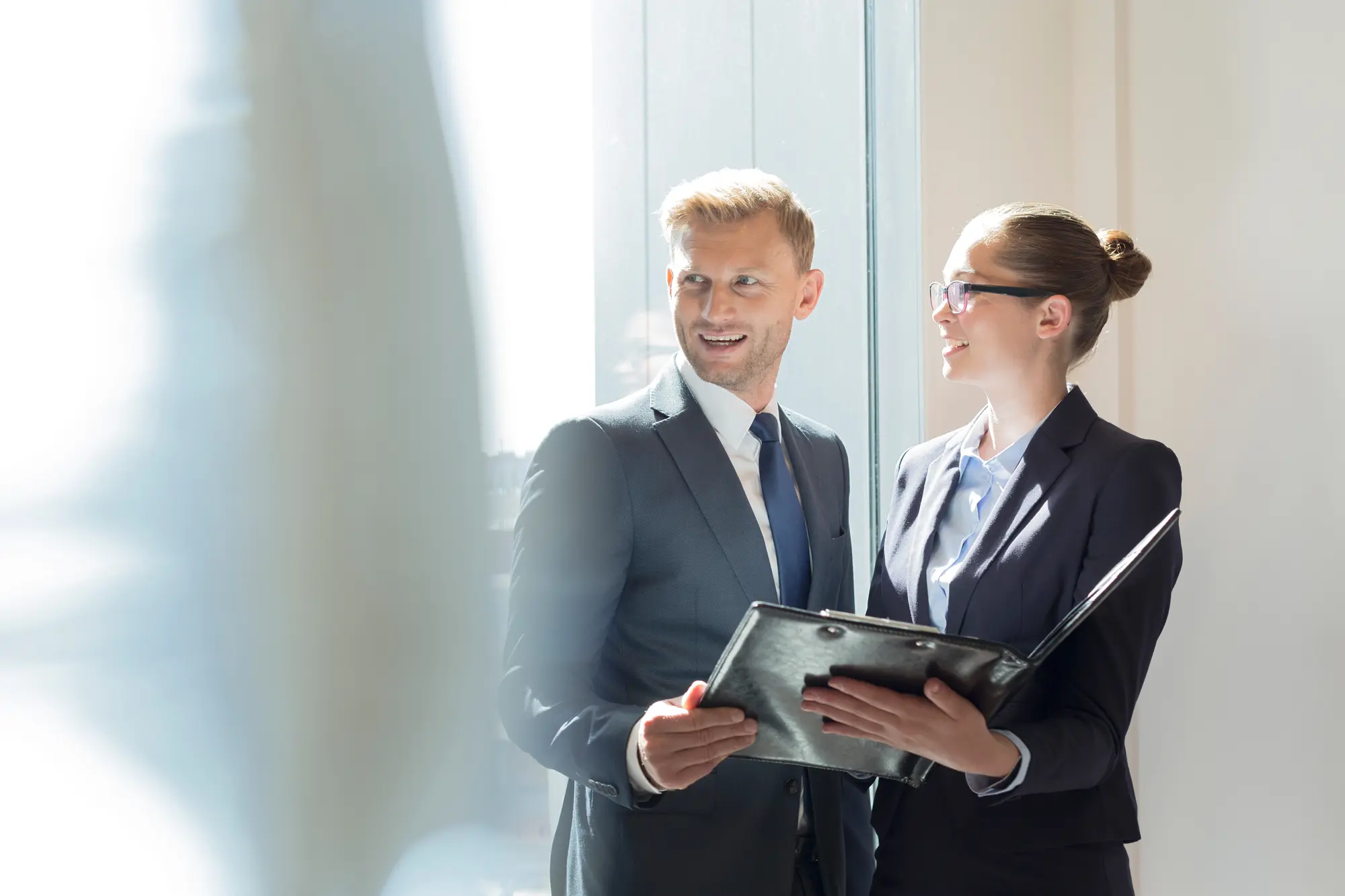 Two advisors reviewing a report