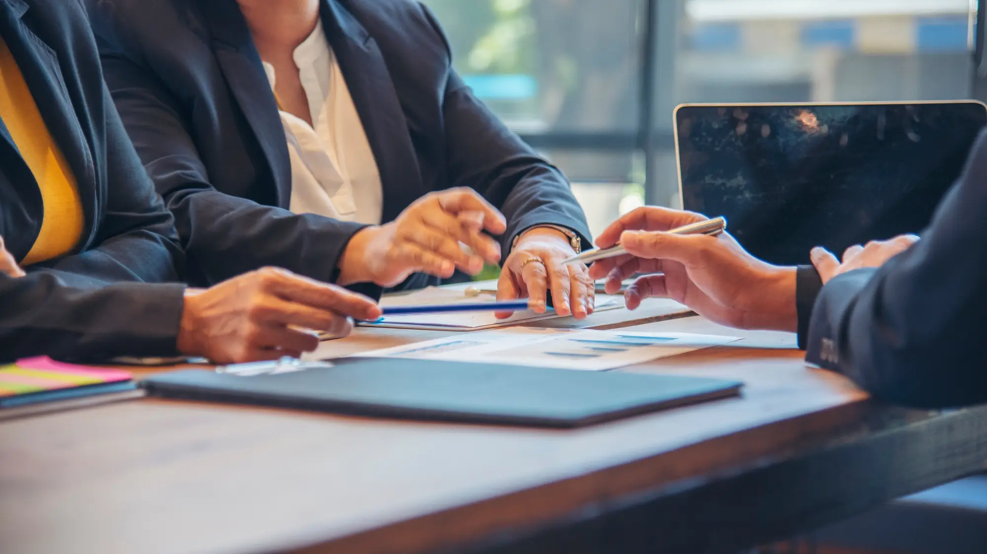 Advisors reviewing documents with a business owner